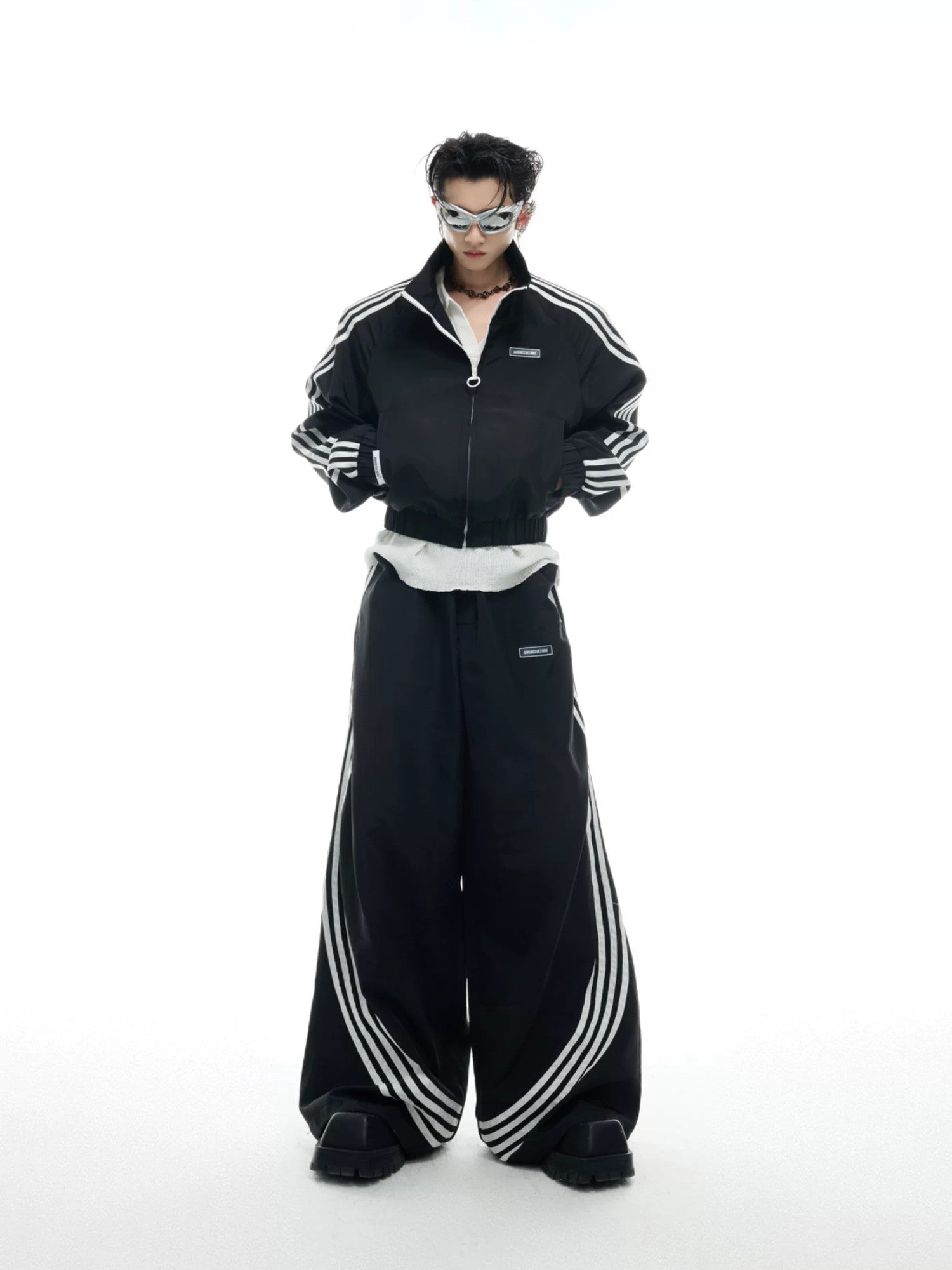 Close up of high-quality metal zipper and chest branding on track jacket