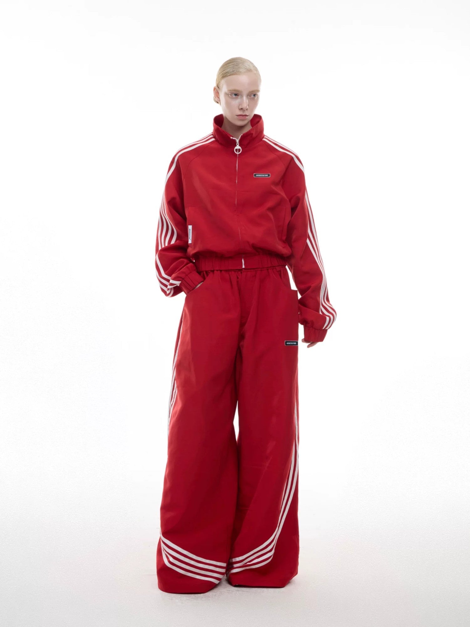 Urban street style photo of the full retro tracksuit set in black