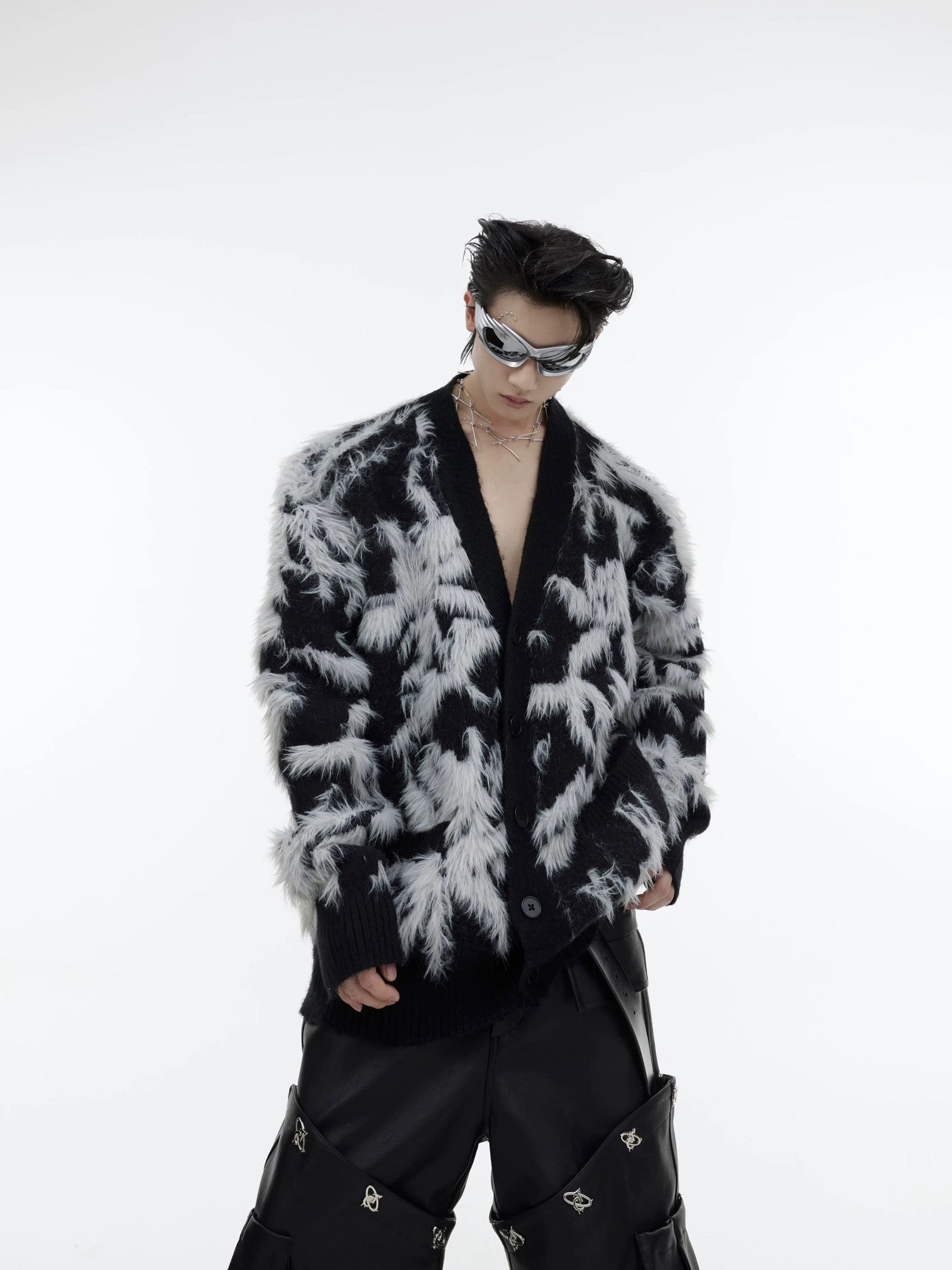 Front view of the oversized black faux mink cardigan with jacquard details.