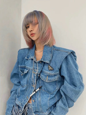 Back view of the loose fit cropped denim jacket in vintage blue