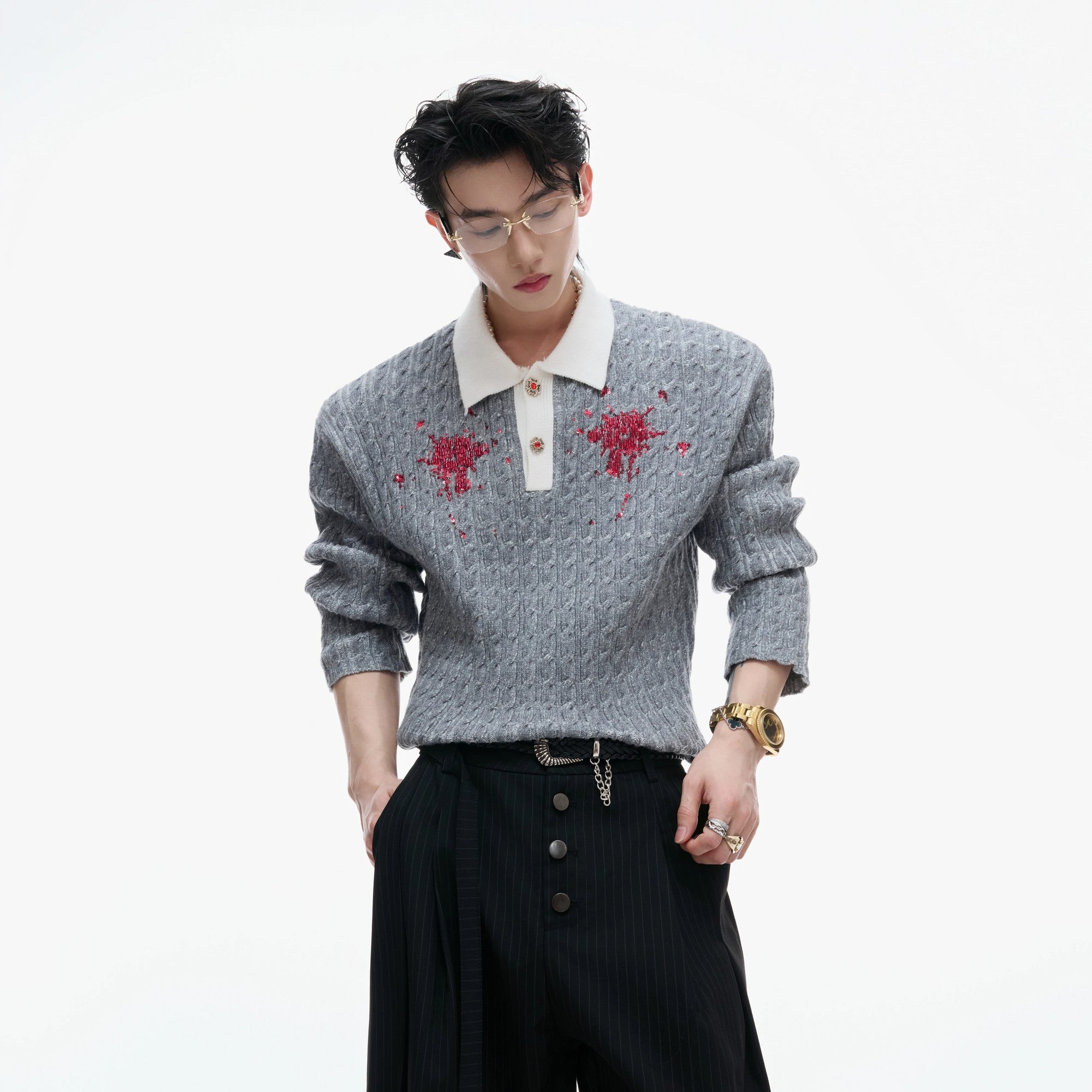 Detail shot of sequin embroidery on a contrast lapel knit top