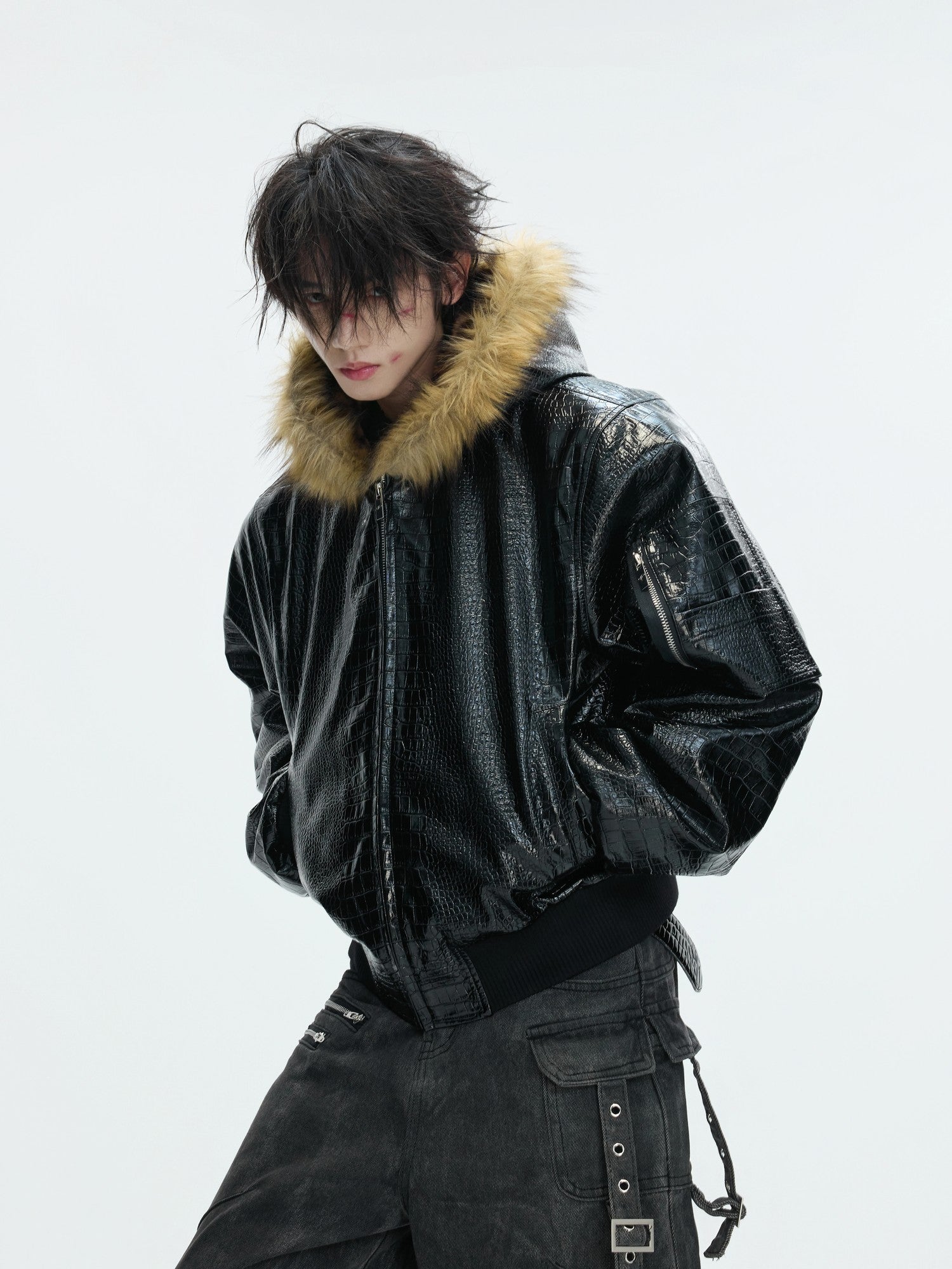 Model wearing the oversized reversible bomber in a street setting