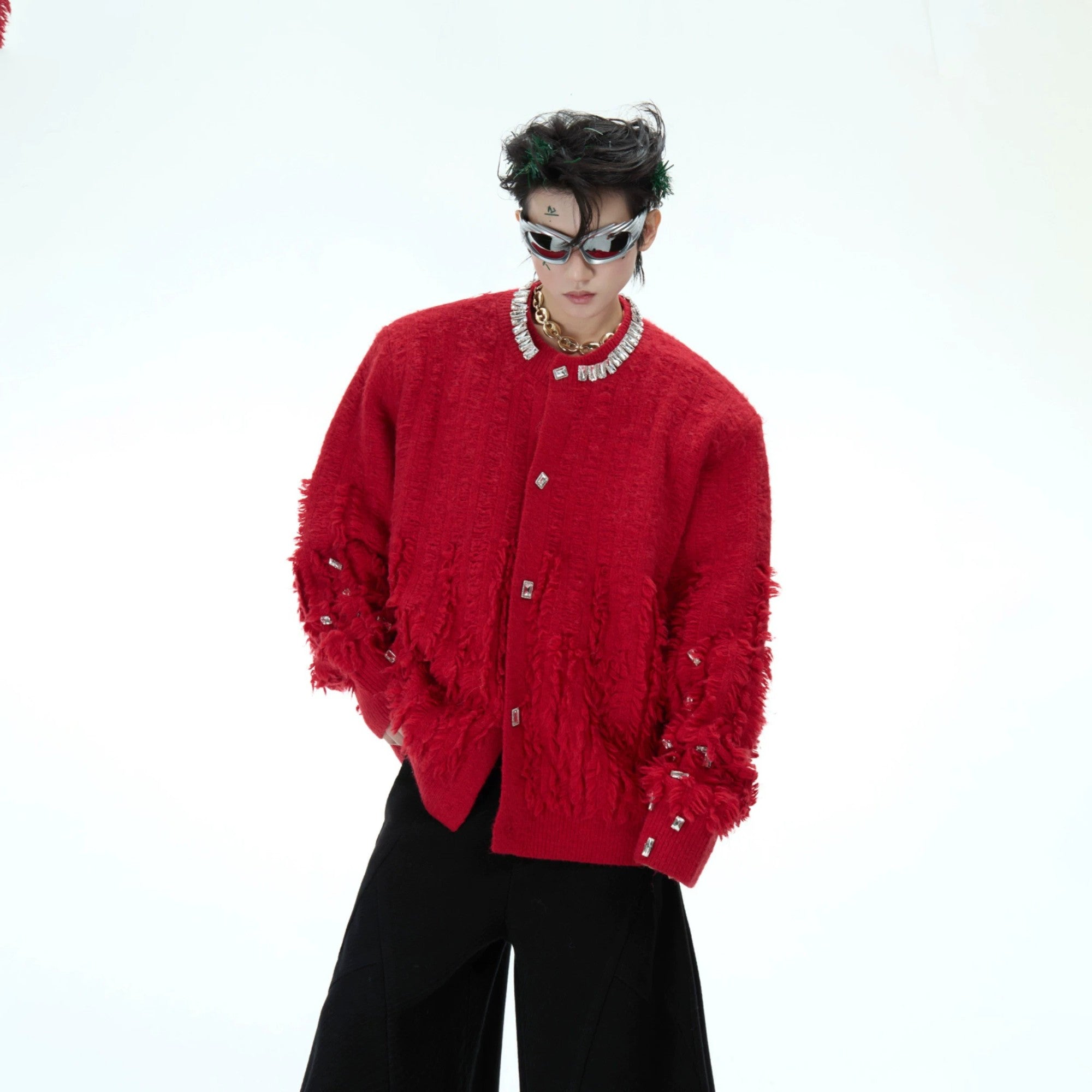 Close-up of sparkling rhinestones on the sleeve of a luxury knit sweater.