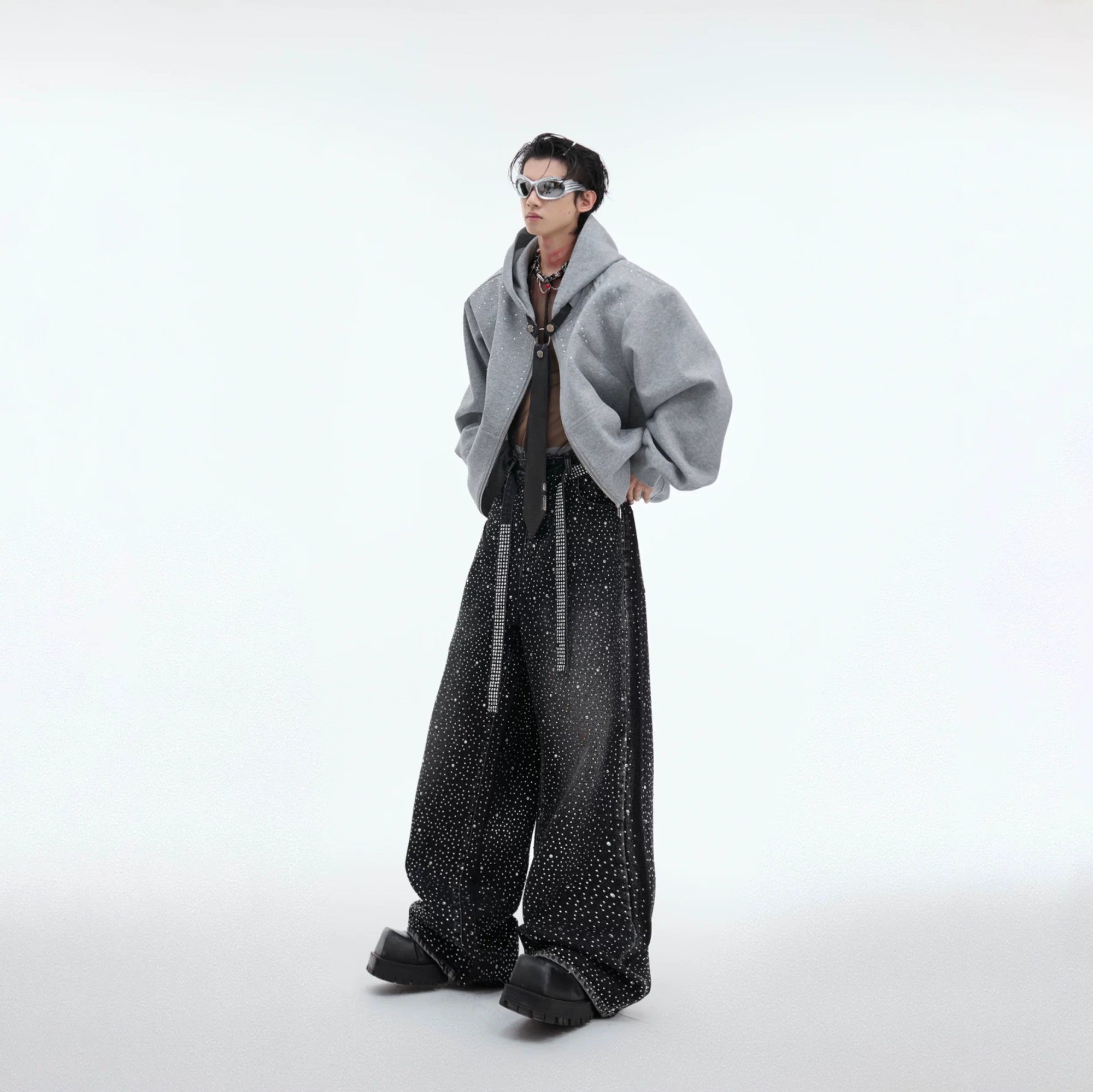 Model wearing starry wide-leg jeans in an urban street setting