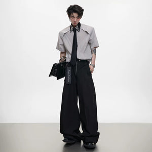 Blue and khaki striped patchwork shirt showing the detachable tie accessory.