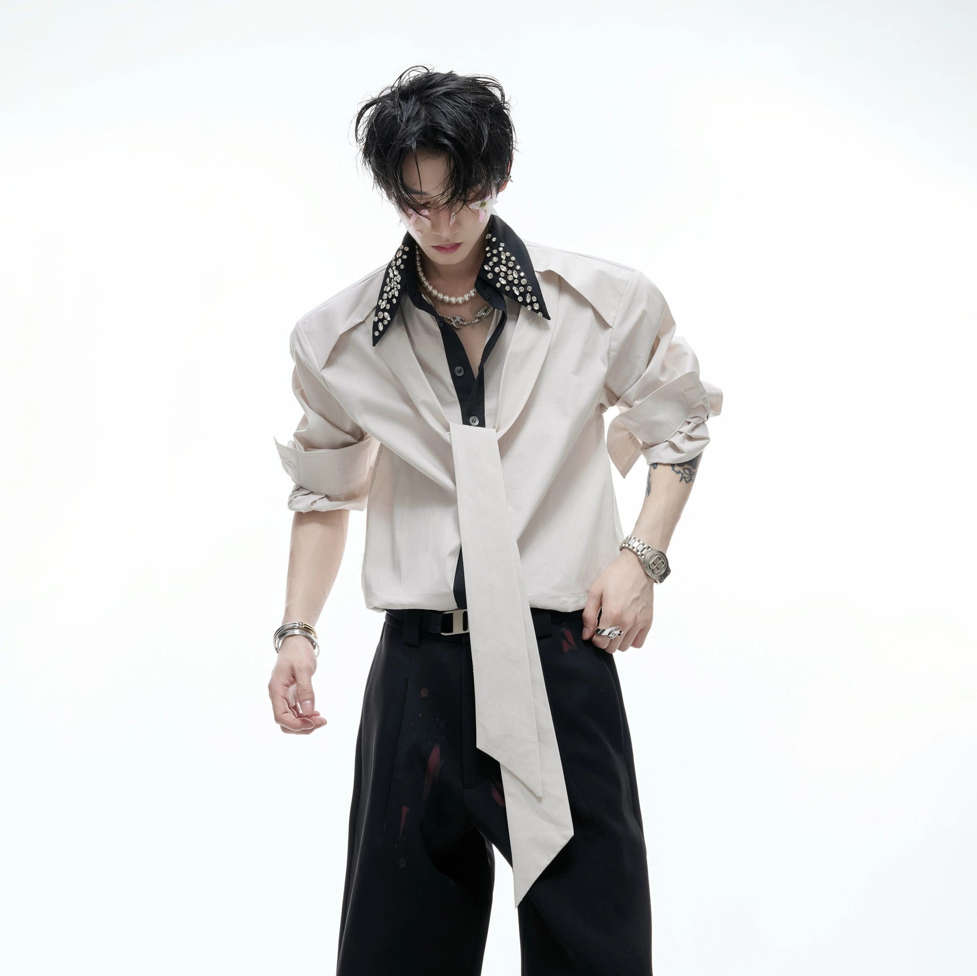 Model wearing the blue striped luxury shirt in a street style setting.