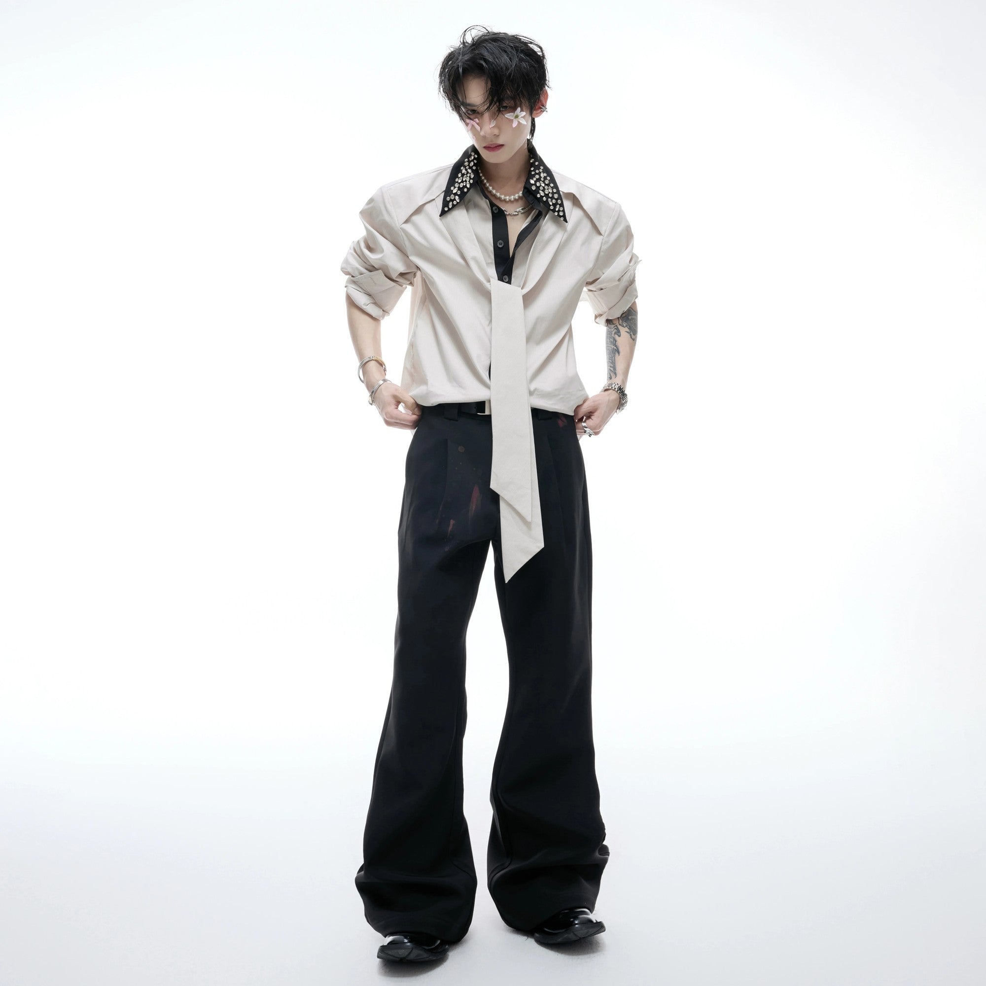 Detail shot of the unique streamer and patchwork design on the sleeve.