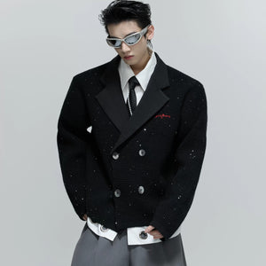 Close-up detail of the subtle sequins on the textured wool blend fabric.