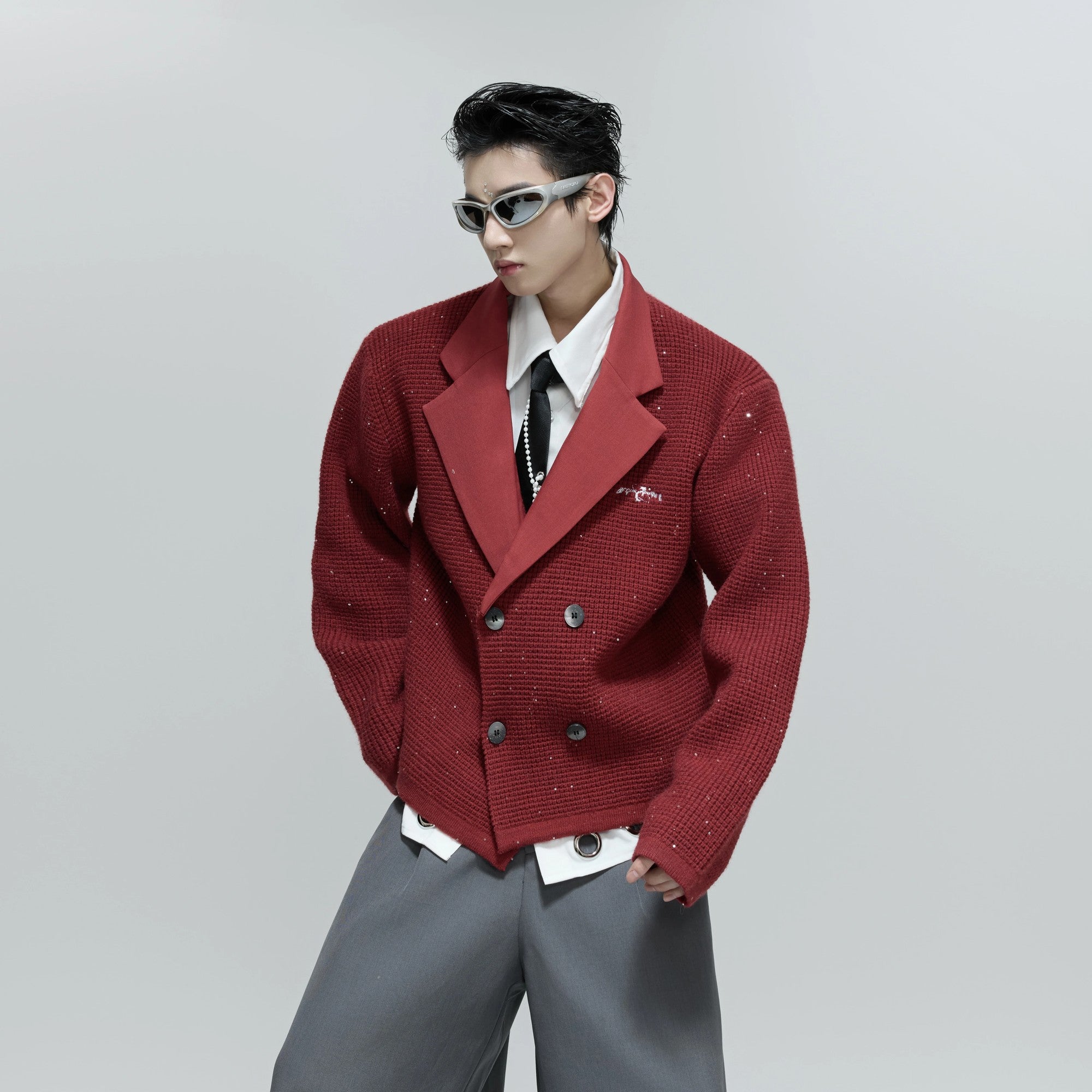 Model wearing the white sequin blazer in a casual urban setting.