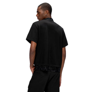 Street style outfit featuring sequin patchwork tee and baggy denim