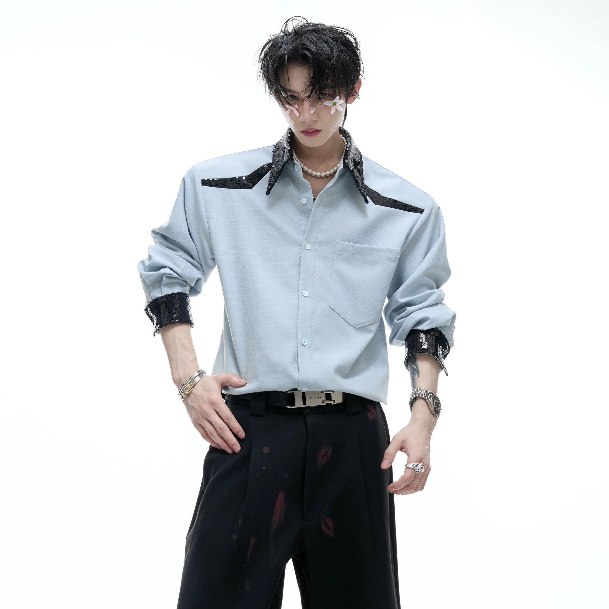 Close-up of structured shoulder pads and sequin collar detail