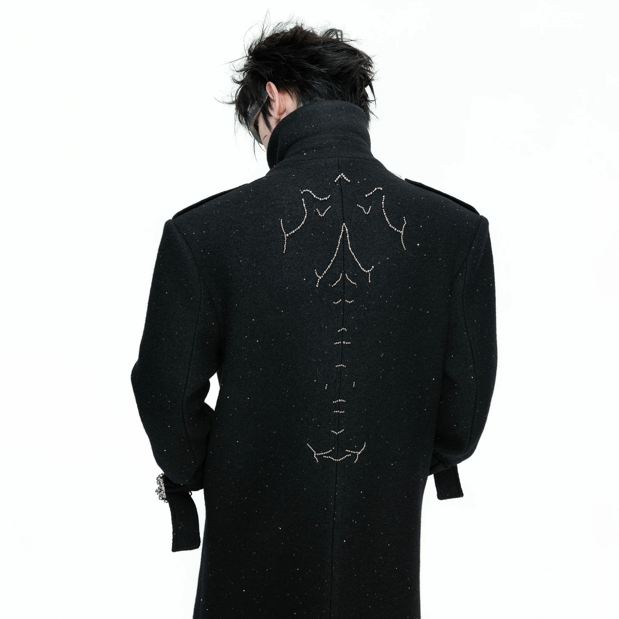 Model wearing the sequin wool coat in a city street setting