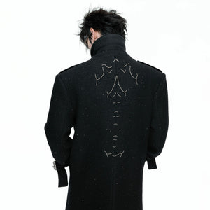 Model wearing the sequin wool coat in a city street setting