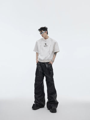 Model wearing the shimmer cropped tee in a urban street setting