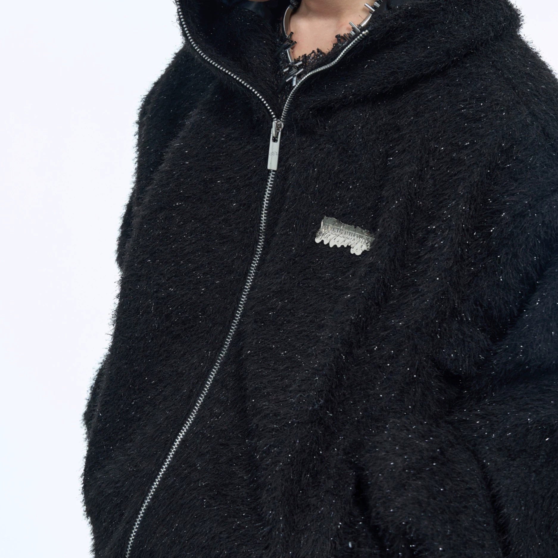 Close-up of the premium shimmer fringe fabric and hardware accents