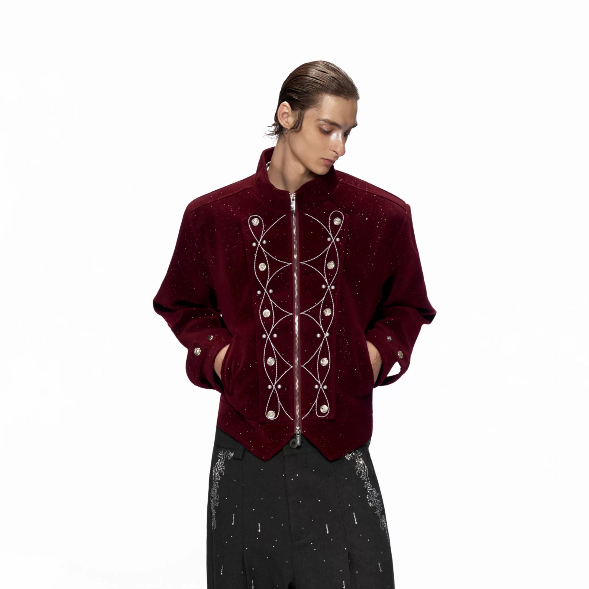 Back of the jacket featuring a metallic snake and pearl shield design