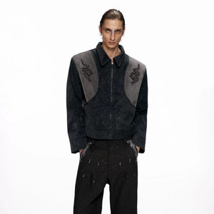 Close up of 3D metallic studded spine detail on back of jacket