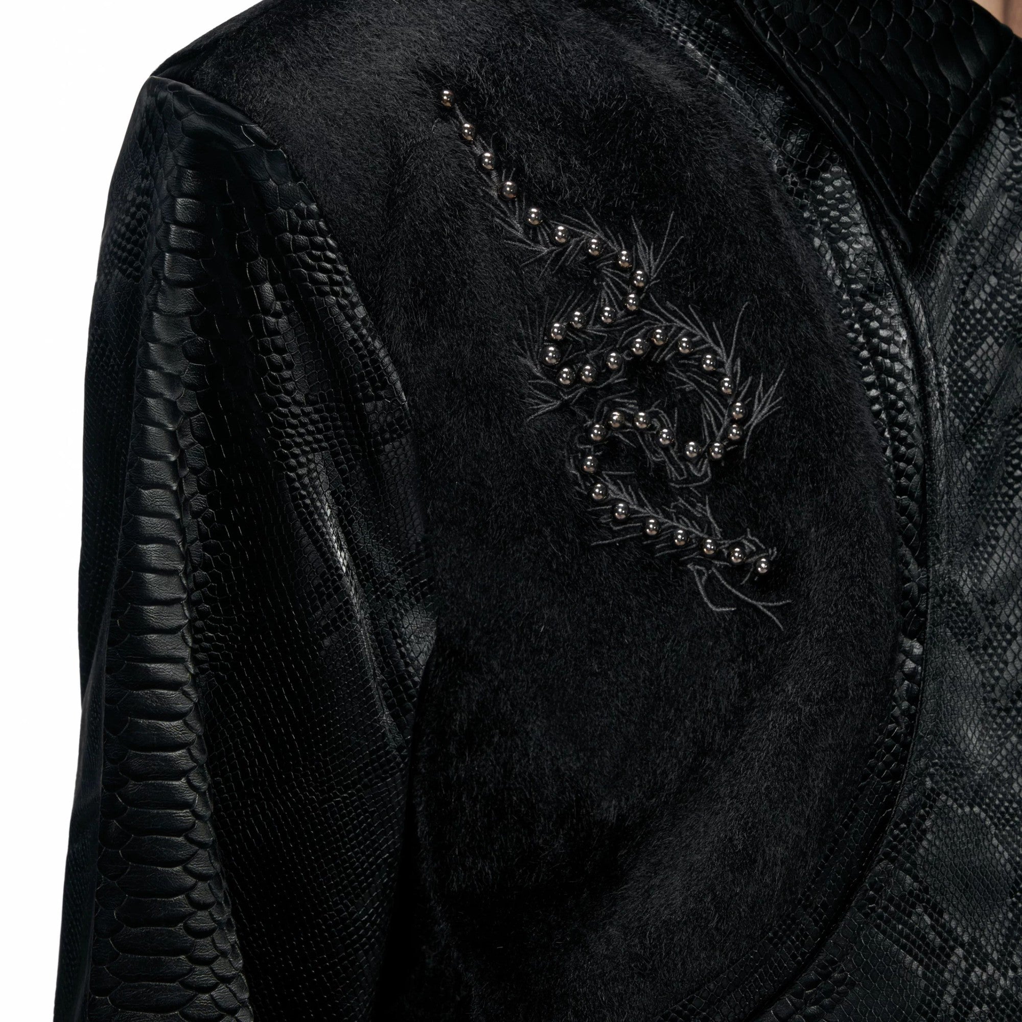 Back view of gray gothic streetwear jacket with spine rivets