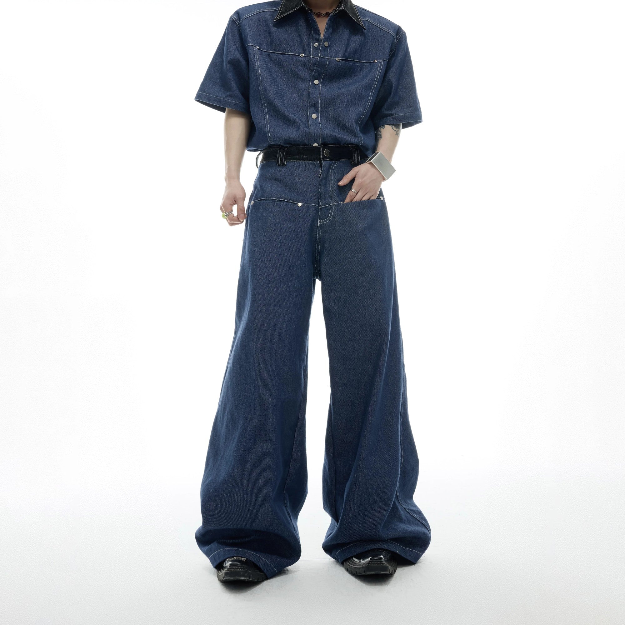 Macro shot of custom branded buttons and rivet details on the denim fabric