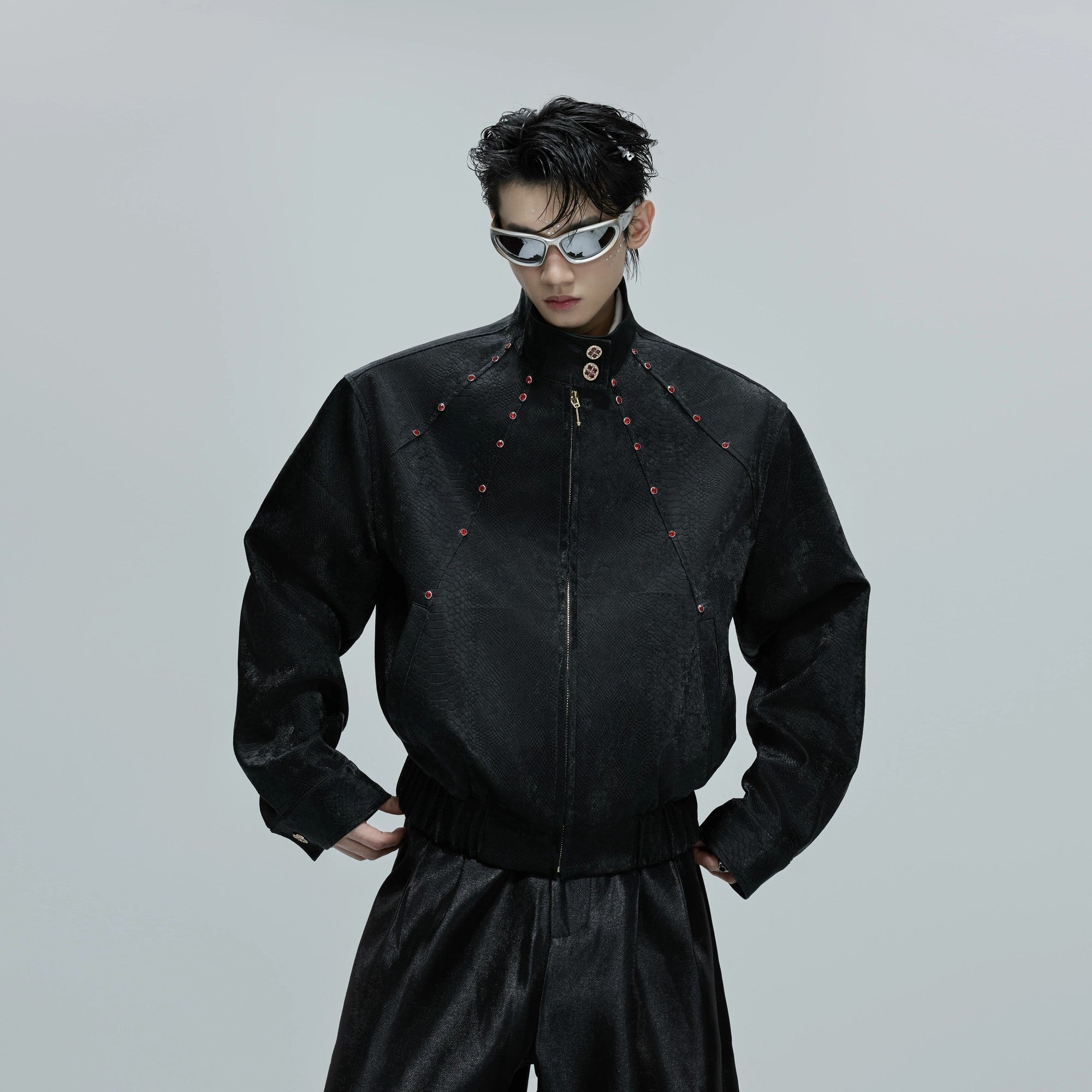 Model wearing a cropped snake skin jacket in a street setting