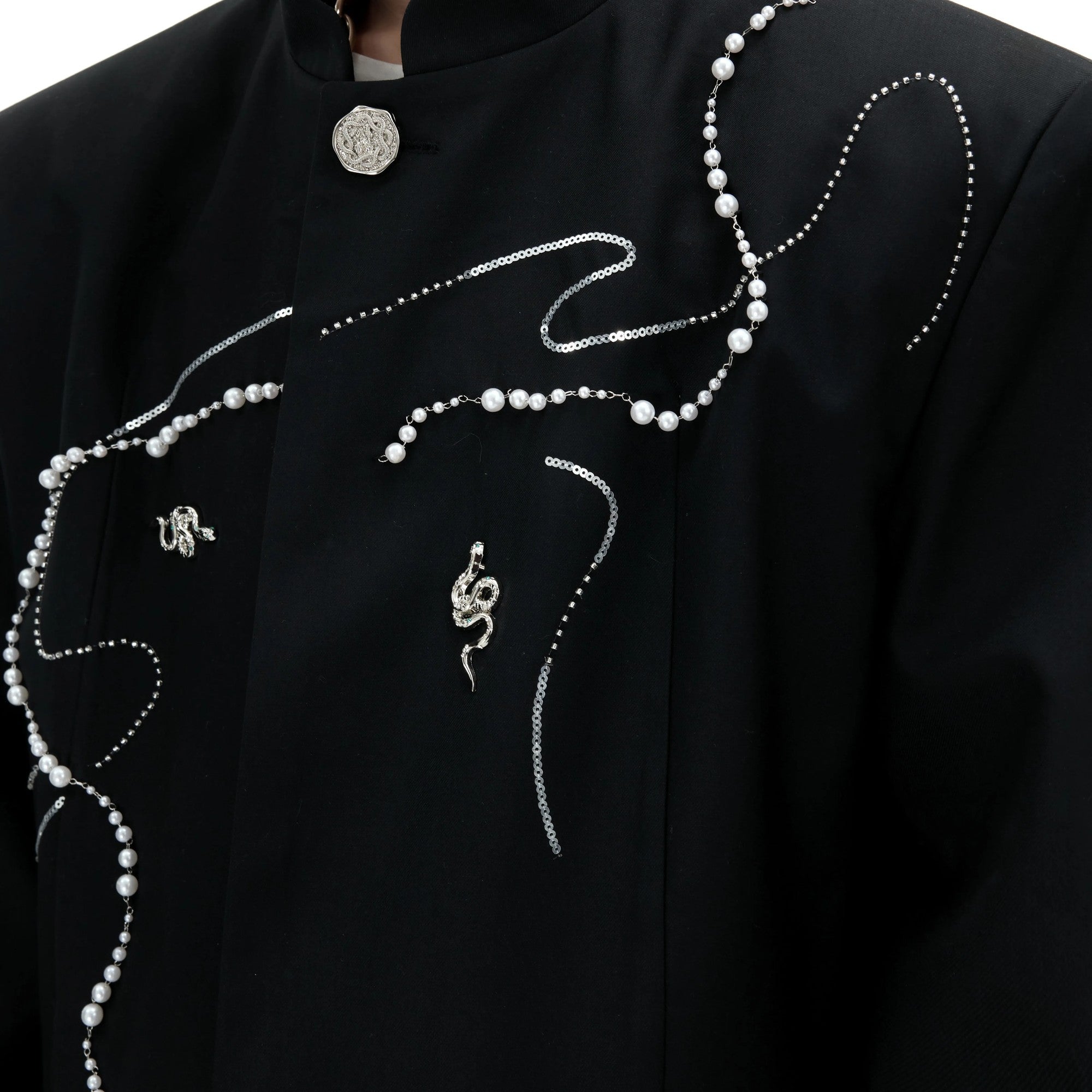 Detailed shot of the premium jacquard fabric and sequin finish