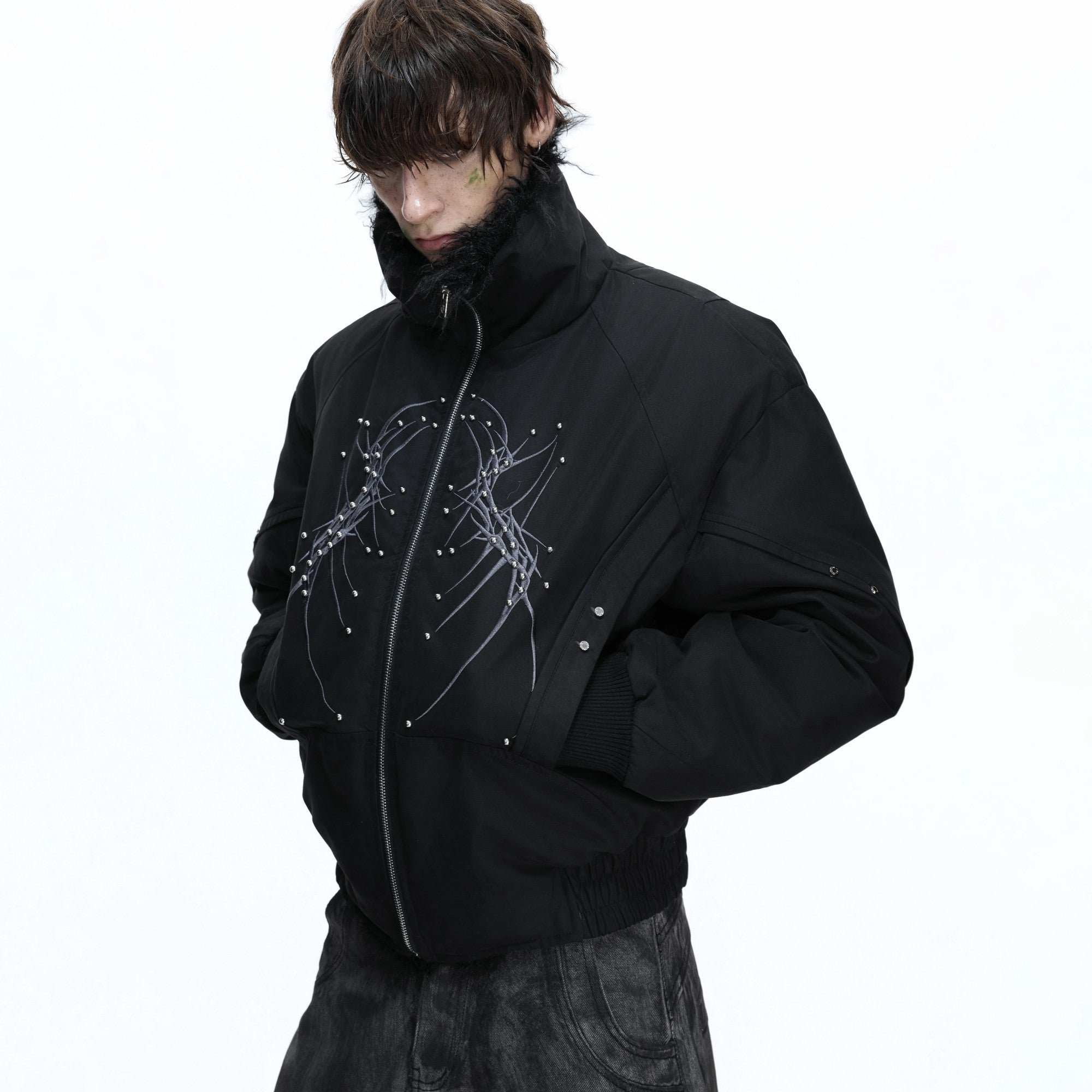 Model wearing white boxy padded jacket in urban setting