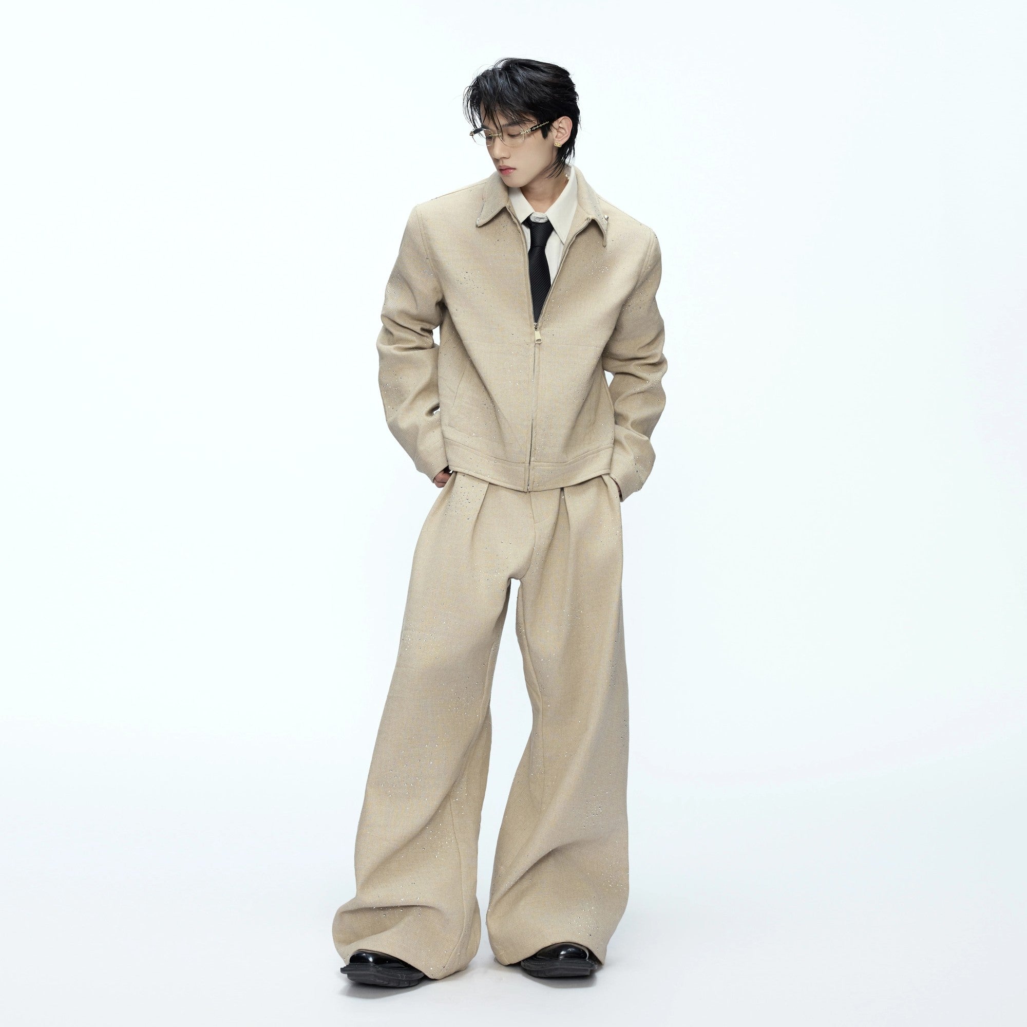 Close-up of heavy-duty star rhinestone embroidery on premium cotton fabric.