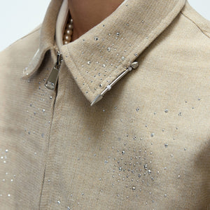 High-quality metal zipper and contrast collar detail on a cropped jacket.