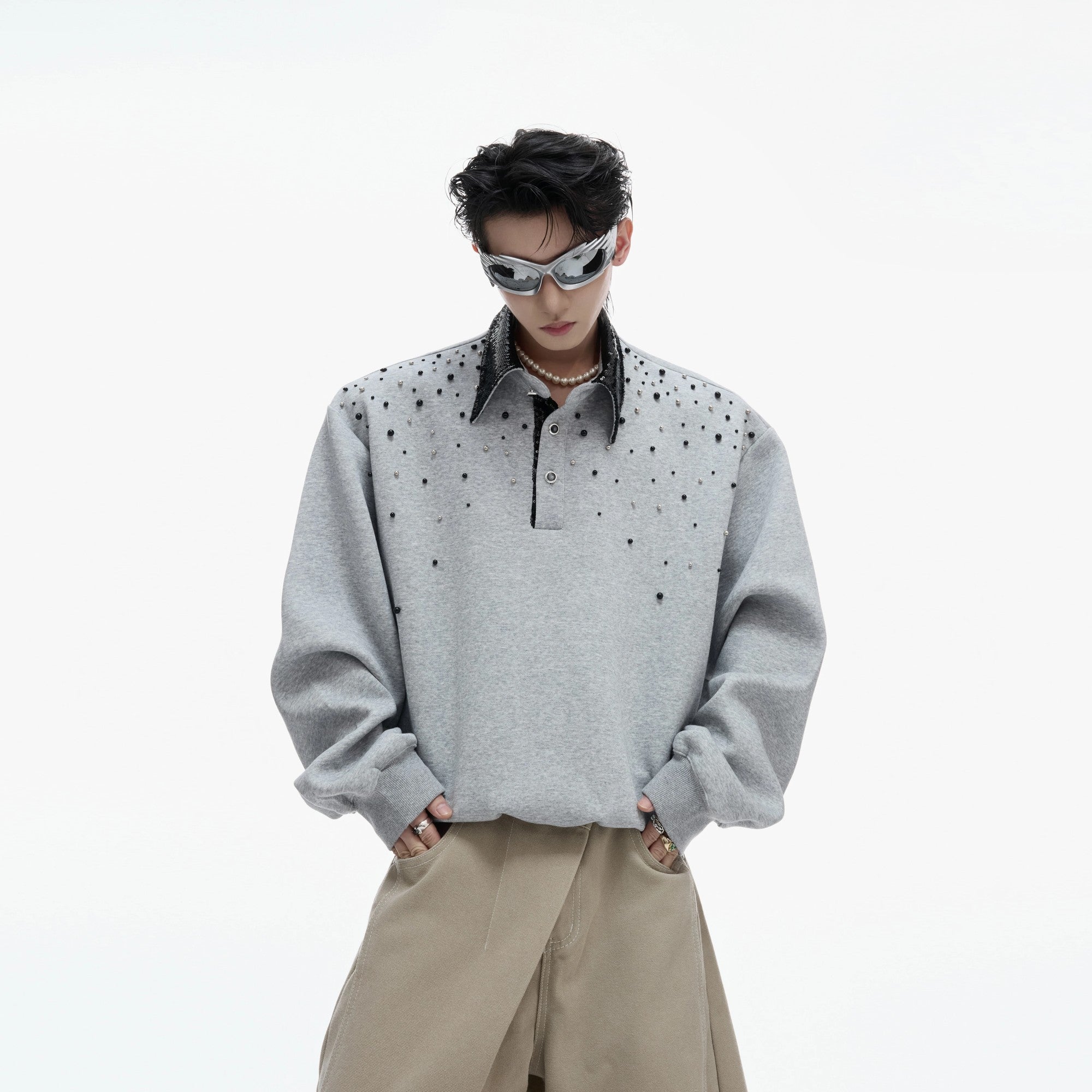 Close-up of premium pearl and sequin embroidery on streetwear polo