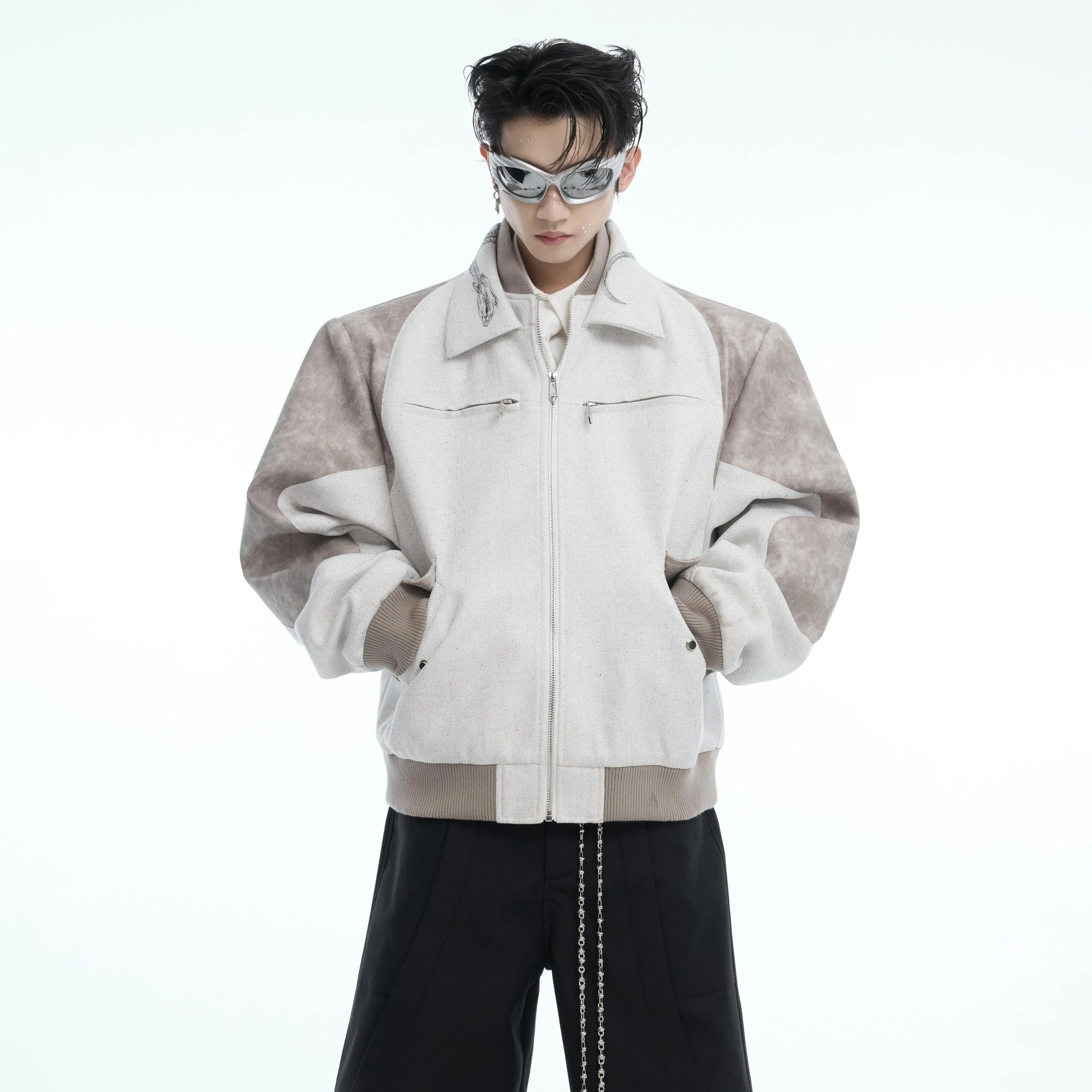 Men's black cropped jacket with snake print patchwork and double collar.