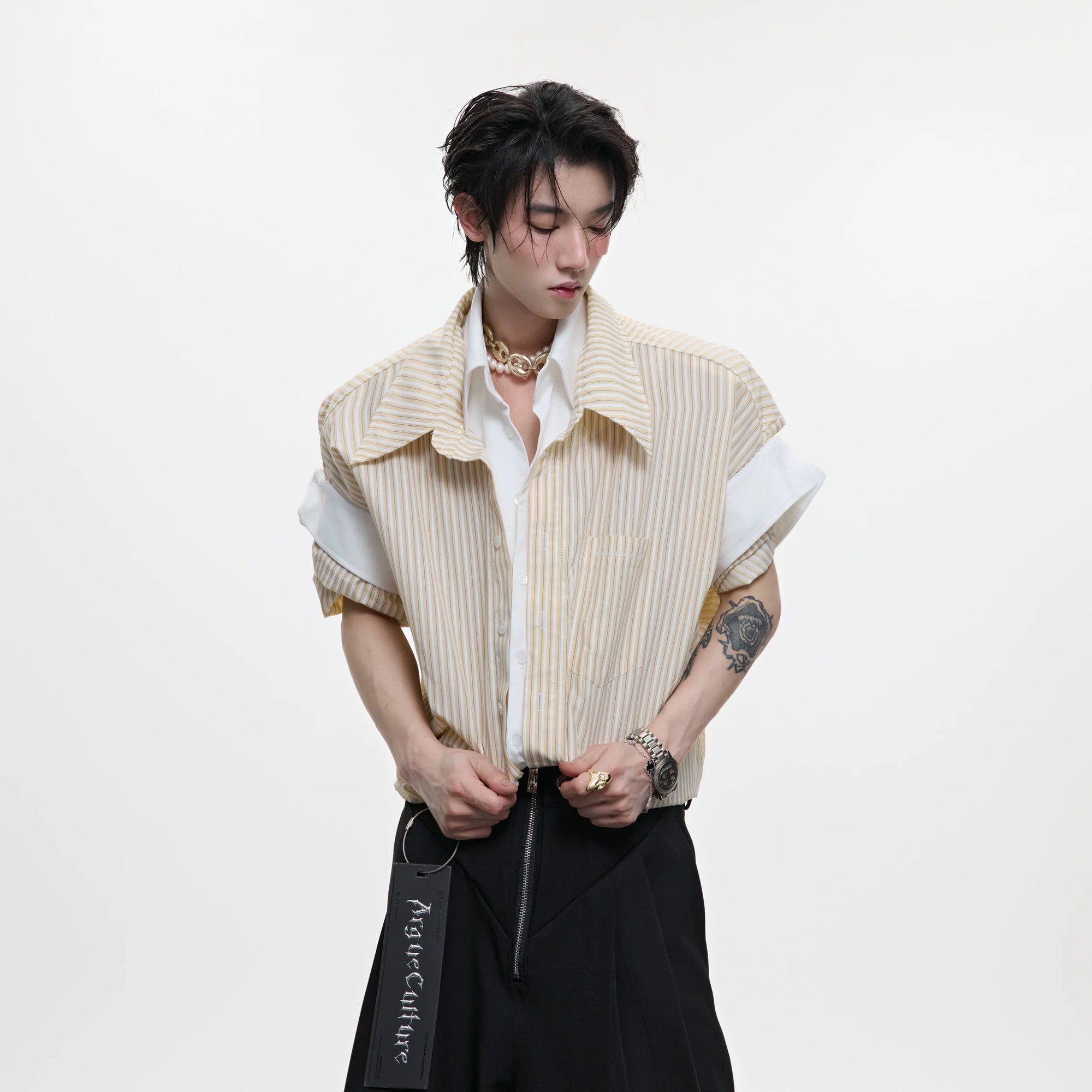 Model wearing a yellow striped oversized preppy shirt with a contrast white collar.