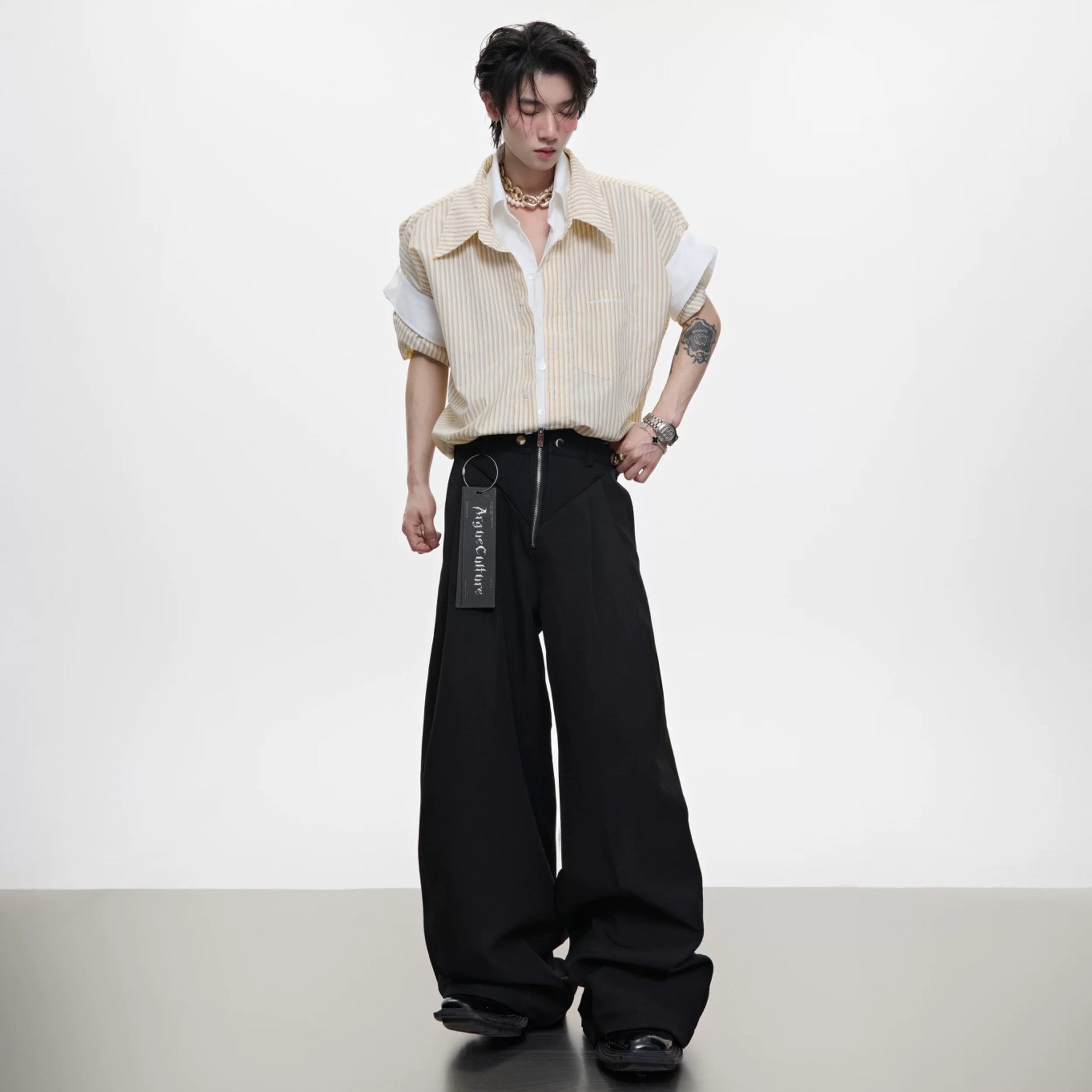 Back view of the oversized blue striped shirt showing the relaxed silhouette.