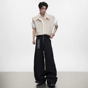 Back view of the oversized blue striped shirt showing the relaxed silhouette.