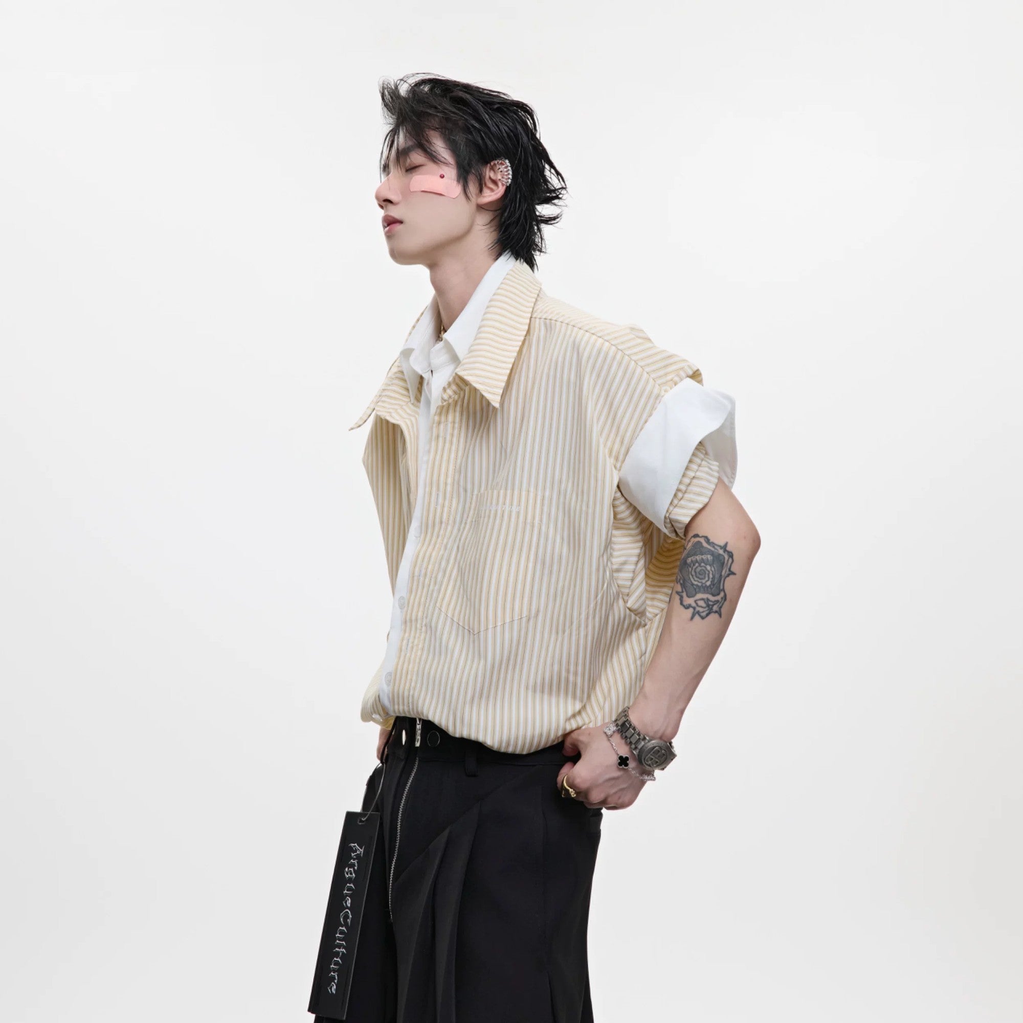 Detailed shot of the chest pocket and striped fabric texture.