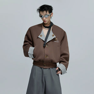Front view of a striped faux two-piece collarless jacket in khaki
