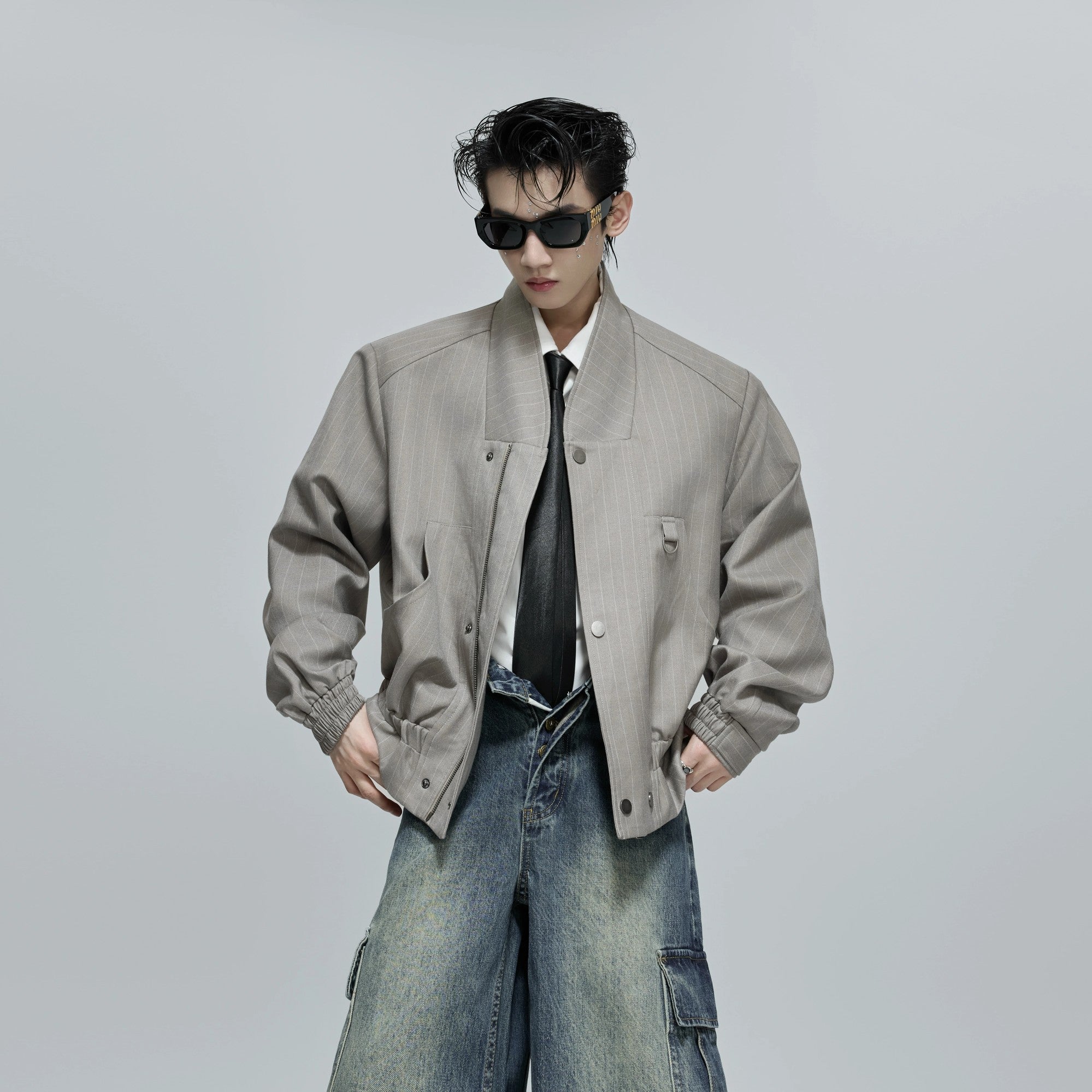 Back view showing the loose silhouette of the striped jacket