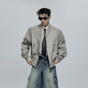 Back view showing the loose silhouette of the striped jacket