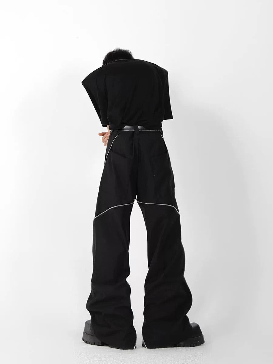 Streetwear outfit featuring micro-flare trousers and chunky sneakers