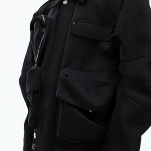 Close up of pleated curved sleeve design on a techwear jacket