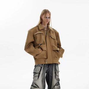 Detailed view of the functional multi-pockets on the front of the jacket