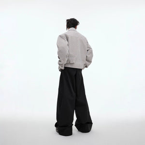 Back view of a loose fit streetwear jacket showing geometric panels