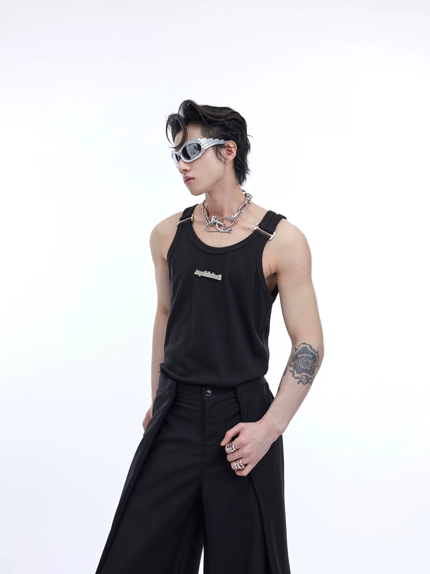Front view of the black textured tank top with metal shoulder straps