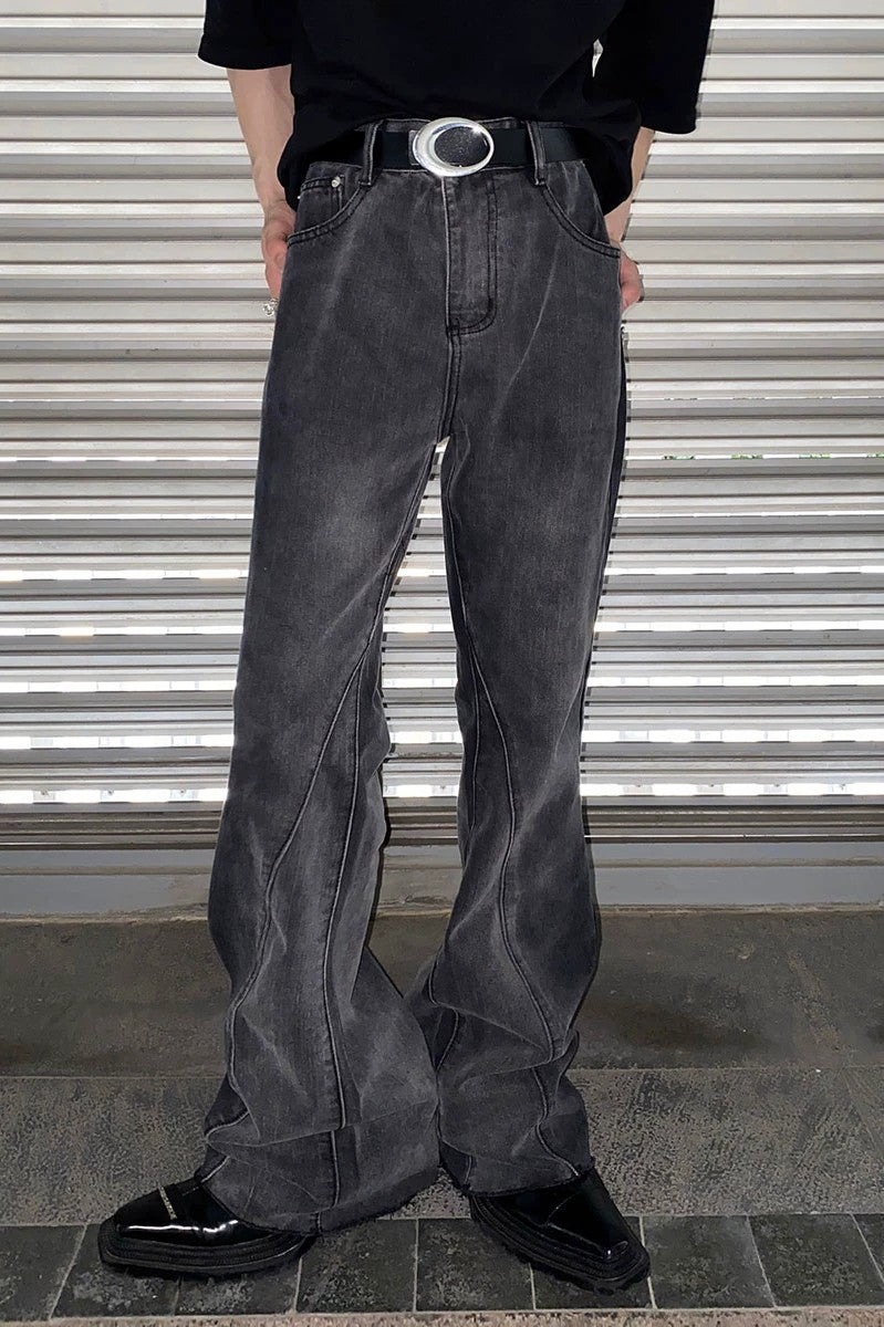 Close-up of distressed hem and tie-dye denim texture