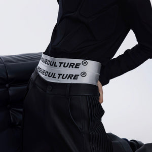 Close-up detail of the triple-layer high-waist and letter print on boxers.