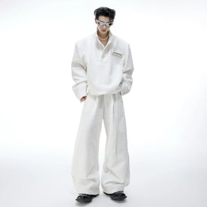 Close up of elegant pearl buttons on a black textured tweed jacket