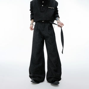 Detailed view of the curved leg design on tweed textured trousers