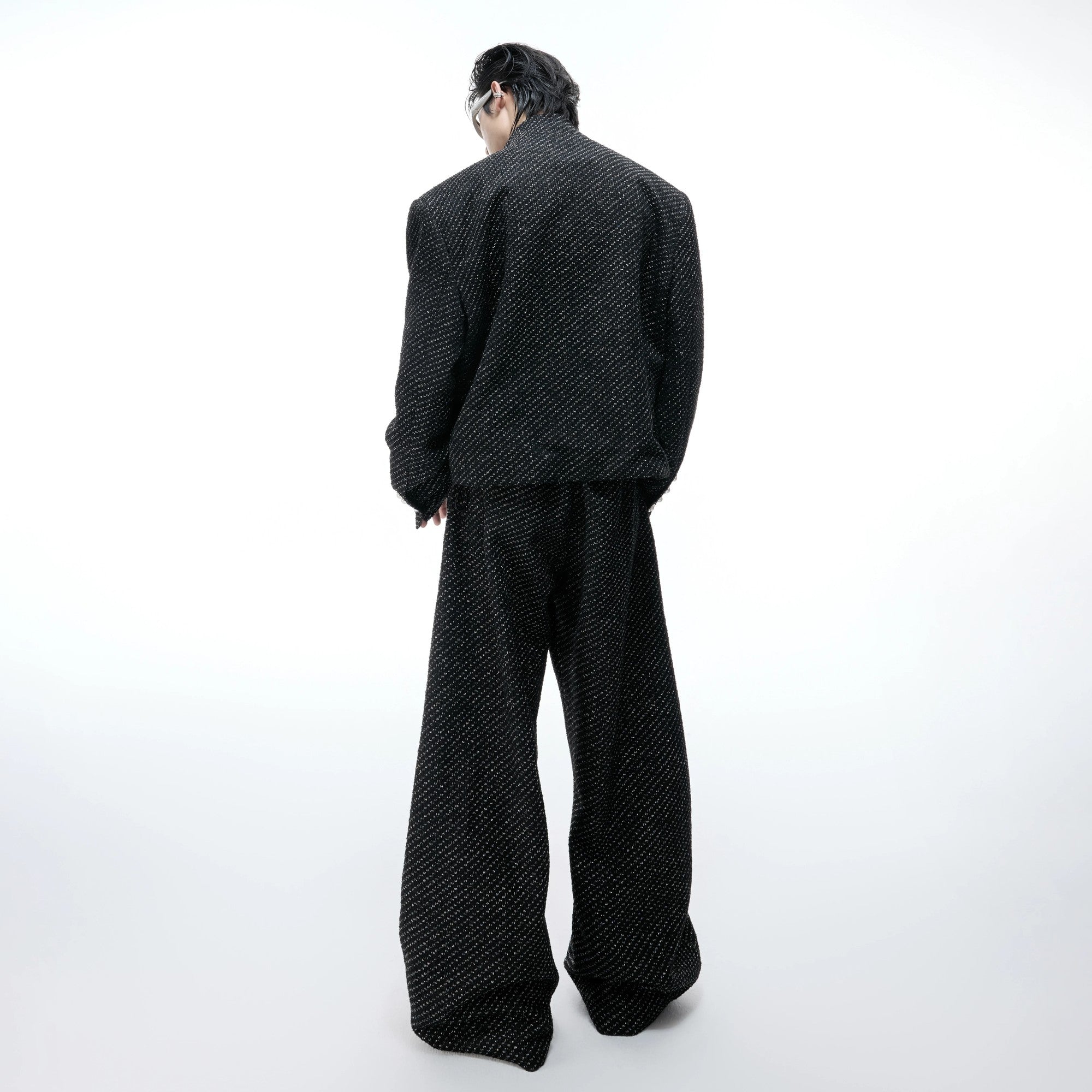 Close up of the adjustable elastic drawstring hem on a street style jacket