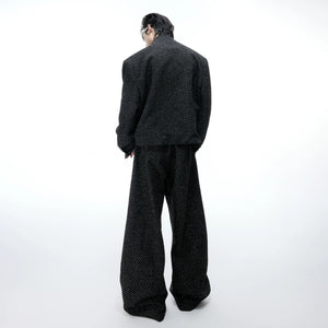 Close up of the adjustable elastic drawstring hem on a street style jacket