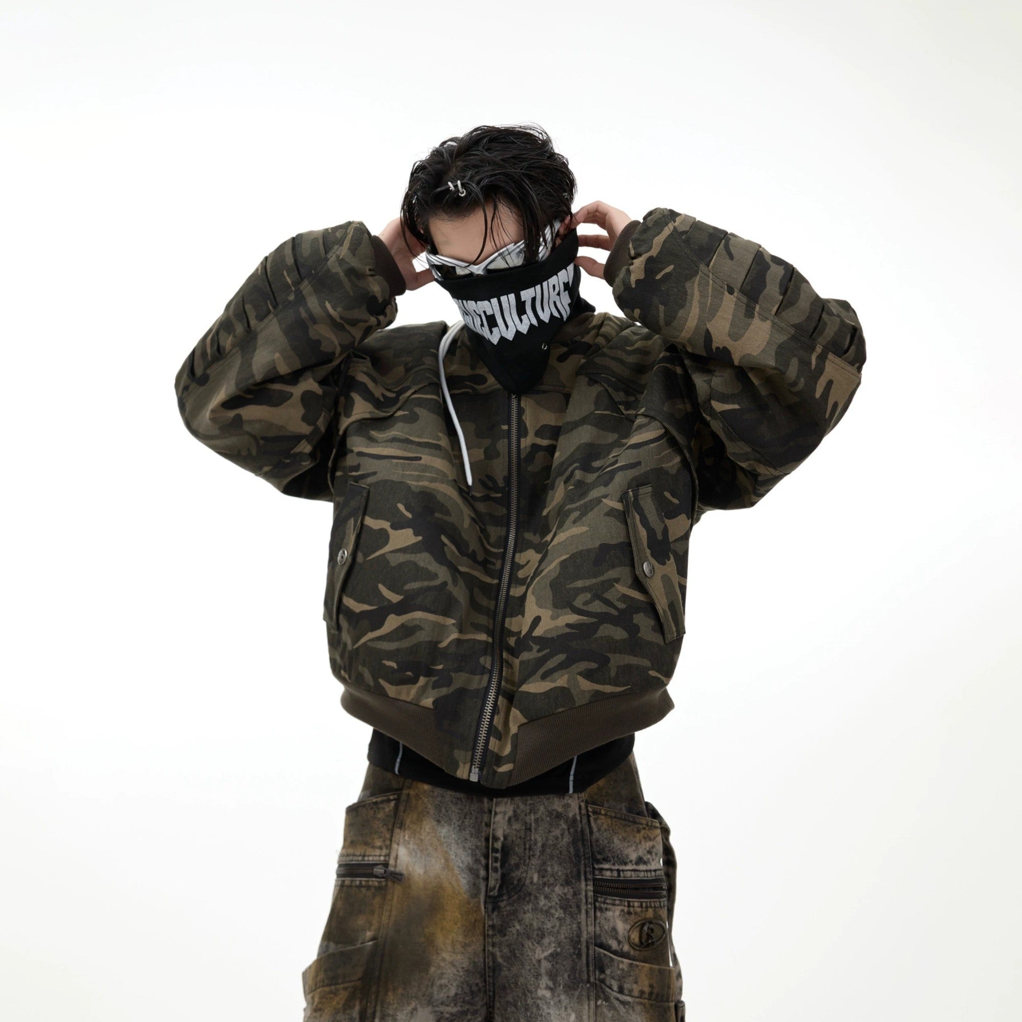 Vintage camouflage bomber jacket with hand-painted graffiti details