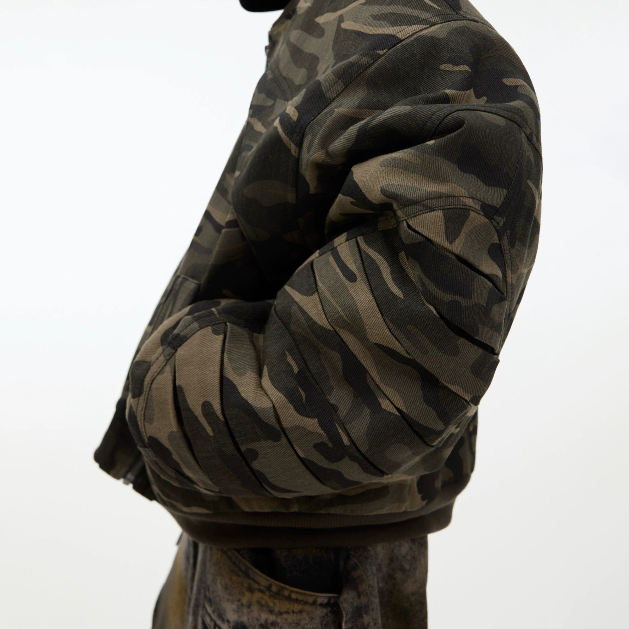 Full body look of a loose fit retro camo bomber jacket styling